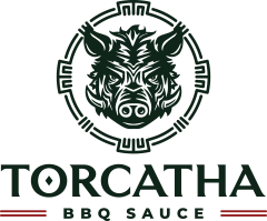 Torcatha BBQ Sauce logo with a hunter green illustrated boar head design on a transparent background.