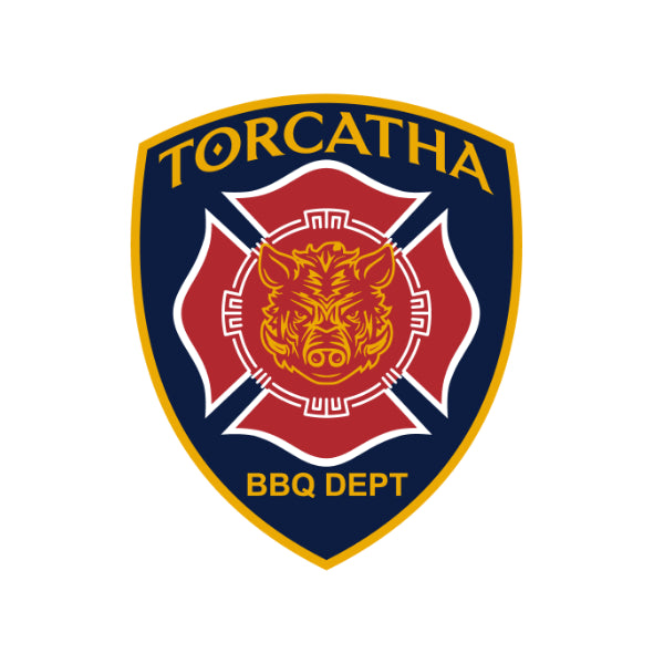 Navy blue, red, and yellow fire badge featuring the Battle Boar image from the Torcatha BBQ Sauce brand.  