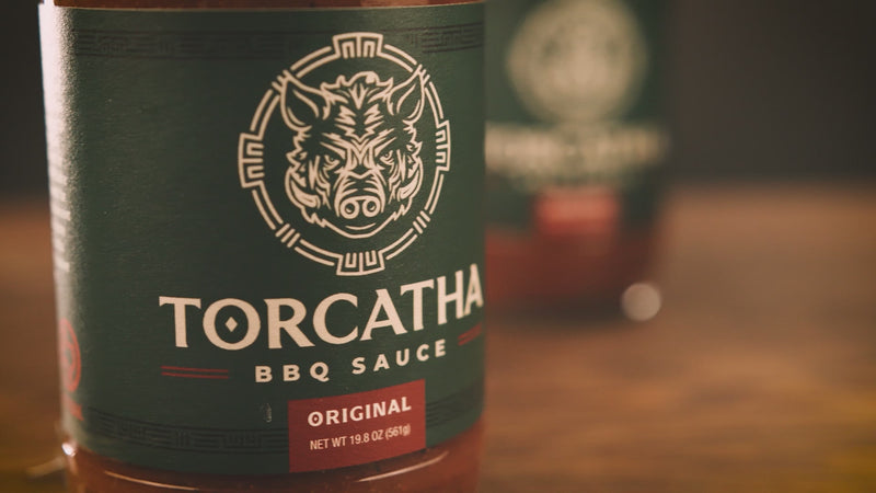 Video panning three bottles of Torcatha Original BBQ Sauce, the best barbecue sauce for ribs, wings, and pulled pork. 